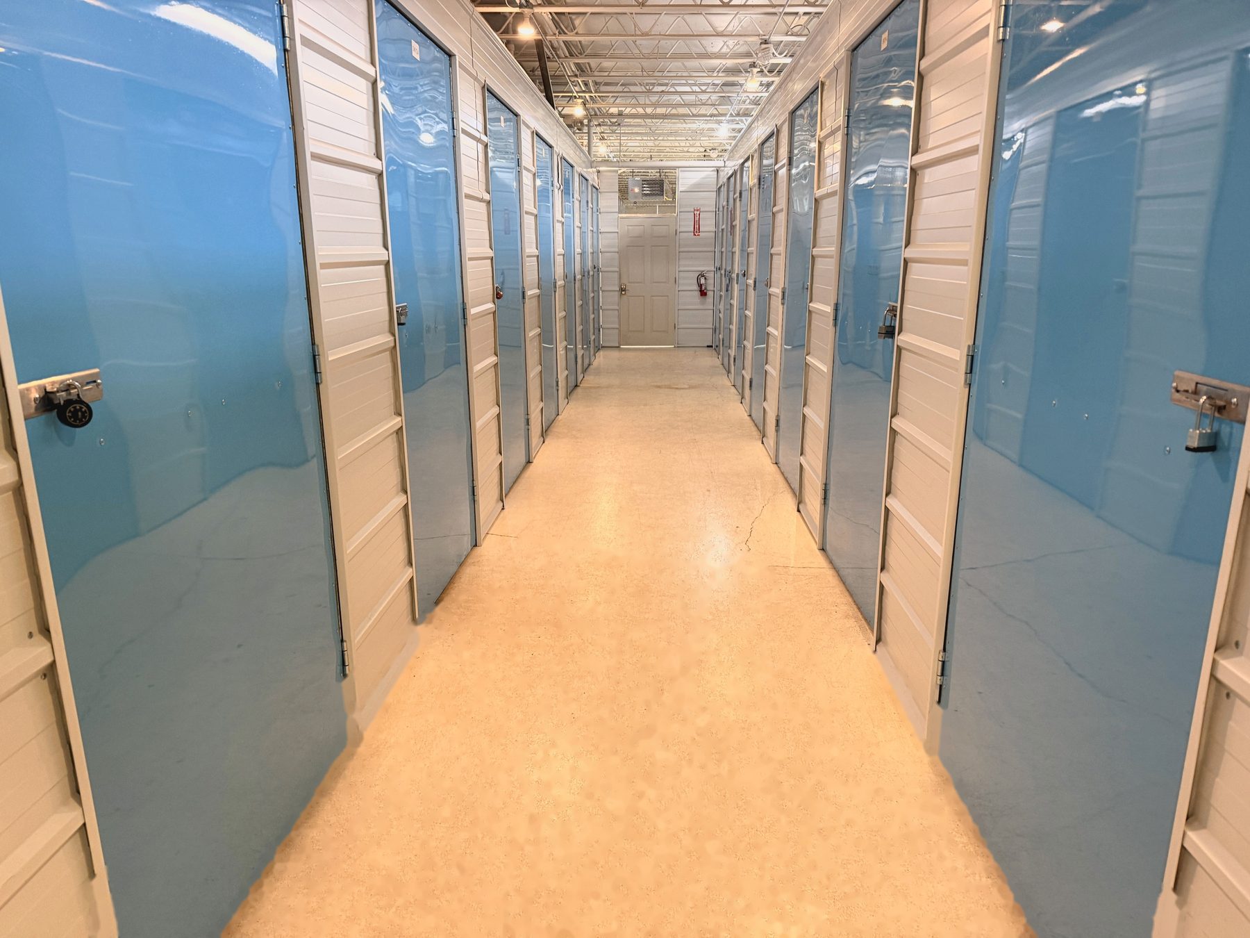 Blue-door hallway inside Storio Anchorage