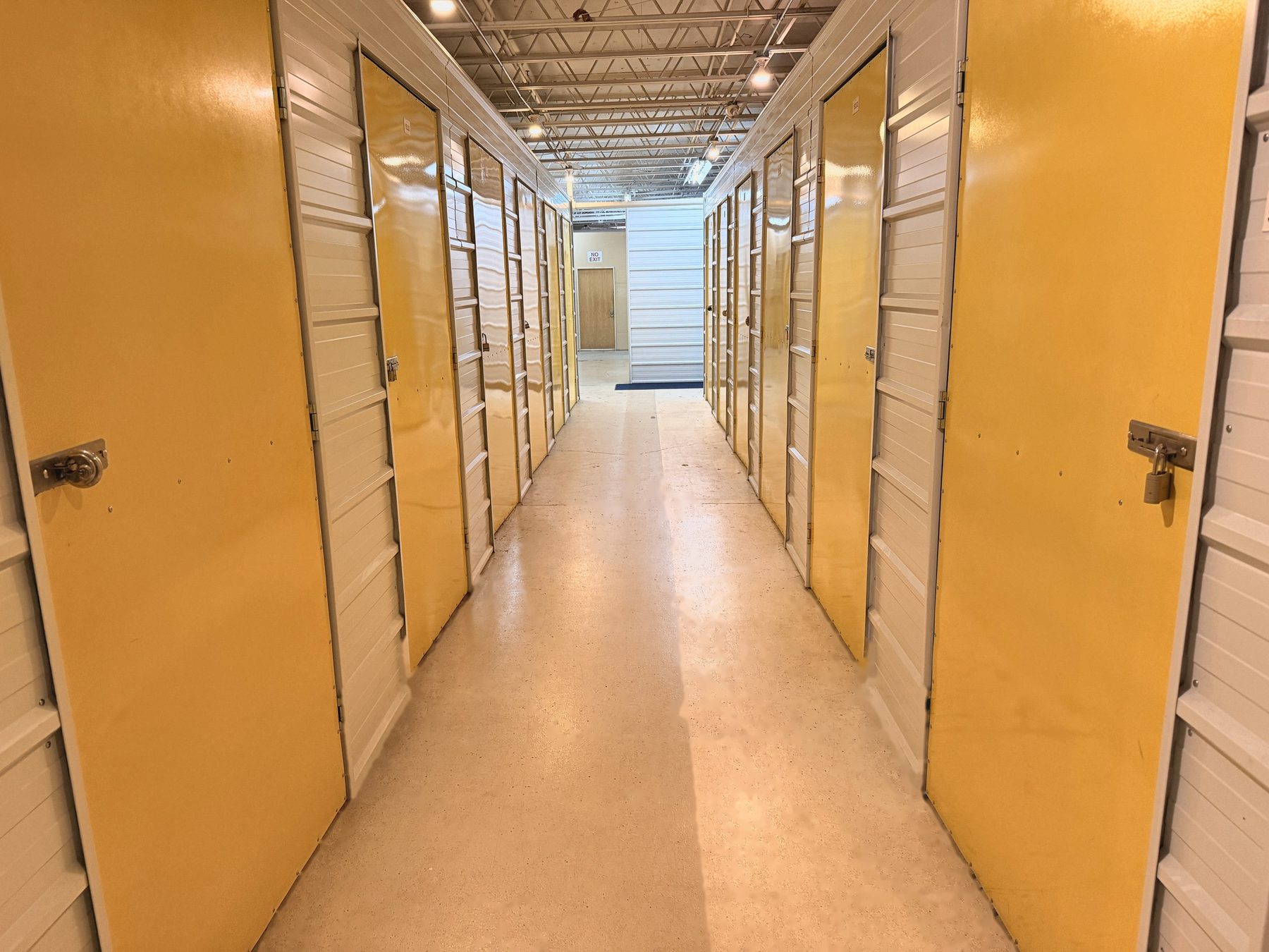 Yellow-door hallway inside Storio Anchorage
